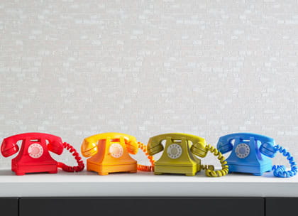 Four colourful telephones